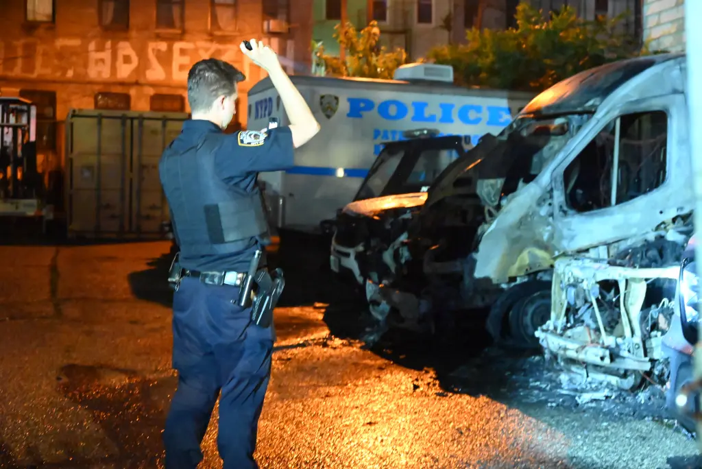 NYPD vehicles torched in suspected arson attack as cops find undetonated explosive devices nearby